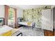 Bright bedroom with trendy floral wallpaper, hardwood floors, and comfortable furnishings at 1682 Grace Se St, Atlanta, GA 30316