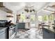 Bright kitchen with stainless steel appliances, white subway tile backsplash, and checkered floors at 1682 Grace Se St, Atlanta, GA 30316