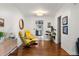 Cozy living room showcasing hardwood floors, stylish yellow chairs, and modern decor at 1682 Grace Se St, Atlanta, GA 30316