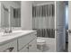 Bathroom with white vanity, toilet, and bathtub with shower at 204 Mahnaz Dr, Atlanta, GA 30331