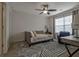 A bedroom with neutral walls, ceiling fan and decorative striped carpet at 204 Mahnaz Dr, Atlanta, GA 30331