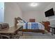 Bedroom featuring a window with natural light and mounted TV at 204 Mahnaz Dr, Atlanta, GA 30331