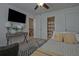 Bedroom featuring neutral walls, ceiling fan and decorative striped carpet at 204 Mahnaz Dr, Atlanta, GA 30331