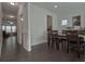Bright dining room featuring hardwood floors, wainscoting, and fresh, neutral paint tones at 204 Mahnaz Dr, Atlanta, GA 30331
