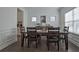 Bright dining room featuring hardwood floors, wainscoting, and fresh, neutral paint tones at 204 Mahnaz Dr, Atlanta, GA 30331