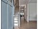 Inviting foyer featuring hardwood floors, staircase, and fresh, neutral paint tones at 204 Mahnaz Dr, Atlanta, GA 30331