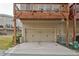 A home with a garage and a wooden deck above, offering outdoor space at 204 Mahnaz Dr, Atlanta, GA 30331