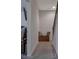 Hallway leading to staircase and room with a tv mounted on the wall at 204 Mahnaz Dr, Atlanta, GA 30331