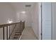 An upstairs hallway with neutral carpet and doors leading to rooms at 204 Mahnaz Dr, Atlanta, GA 30331