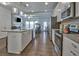 Modern kitchen with white cabinetry, stainless steel appliances, and a granite-topped island at 204 Mahnaz Dr, Atlanta, GA 30331