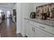 Kitchen cabinet with granite countertop, appliances and a glimpse of the living area at 204 Mahnaz Dr, Atlanta, GA 30331
