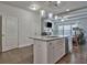Kitchen island with granite countertop, stainless steel dishwasher, and white cabinets at 204 Mahnaz Dr, Atlanta, GA 30331