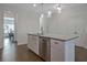 Kitchen island featuring a granite countertop, stainless dishwasher, and white cabinetry at 204 Mahnaz Dr, Atlanta, GA 30331