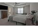 Spacious main bedroom with a ceiling fan, dresser and large window at 204 Mahnaz Dr, Atlanta, GA 30331