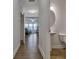 Hallway view showcasing the powder room with wood floors and a pedestal sink at 204 Mahnaz Dr, Atlanta, GA 30331