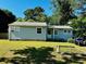 Charming single-story home with light blue siding and a well-maintained front lawn in a tranquil neighborhood at 2225 Misty Ln, Smyrna, GA 30080