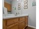 Bathroom vanity features wood cabinets, a white countertop, and modern decor at 291 Goodson Nw Way, Atlanta, GA 30309
