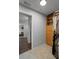 Organized closet with wooden drawers, shelves, and hanging racks, offering a view to the bedroom at 291 Goodson Nw Way, Atlanta, GA 30309