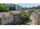 Aerial view of townhome community showing the manicured landscaping, rooftop views, and skyline at 291 Goodson Nw Way, Atlanta, GA 30309