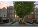Charming townhouses with brick facades, inviting front entrances and lush landscaping at 291 Goodson Nw Way, Atlanta, GA 30309