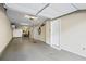 Spacious garage interior with multiple access doors and overhead lighting at 291 Goodson Nw Way, Atlanta, GA 30309