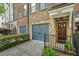Facade showcases a private garage, manicured lawn, and welcoming front door at 291 Goodson Nw Way, Atlanta, GA 30309