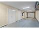 Clean and spacious garage with storage cabinets, overhead lighting, and epoxy floors at 291 Goodson Nw Way, Atlanta, GA 30309