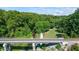 View of the green space with walking trail and creek alongside the train tracks in the community at 291 Goodson Nw Way, Atlanta, GA 30309