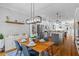 Open-concept kitchen with stainless steel appliances, granite countertops, and a view into the dining area at 291 Goodson Nw Way, Atlanta, GA 30309