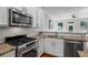 Well-equipped kitchen with stainless appliances, granite countertops, and bright lighting at 291 Goodson Nw Way, Atlanta, GA 30309
