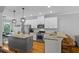 Well-lit kitchen with stainless appliances, hardwood flooring, and granite counters at 291 Goodson Nw Way, Atlanta, GA 30309