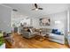 Well-lit living room showcasing hardwood floors, a gray sectional, and an open layout at 291 Goodson Nw Way, Atlanta, GA 30309