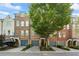 Charming townhomes feature well-maintained landscaping, private garages, and welcoming entrances at 291 Goodson Nw Way, Atlanta, GA 30309