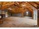 Unfinished attic showing exposed beams and insulation, offering potential for customization and expansion at 4530 Upland Court, Cumming, GA 30040