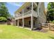 Covered back porch with ceiling fans and views of the large, landscaped yard at 4530 Upland Court, Cumming, GA 30040