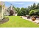 A beautiful backyard with a stone patio, lush lawn, and plenty of room for entertaining at 4530 Upland Court, Cumming, GA 30040