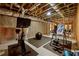 Basement gym with rubber floors, exercise equipment, exposed ductwork and unfinished ceiling at 4530 Upland Court, Cumming, GA 30040