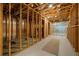 Unfinished basement with wooden framing and concrete floors, offering a blank canvas for future development at 4530 Upland Court, Cumming, GA 30040