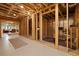 Unfinished basement featuring exposed wooden framing and a wine rack, ideal for future customization at 4530 Upland Court, Cumming, GA 30040