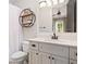 Clean bathroom features a modern vanity, floating shelves, and a shower with white tiling at 4530 Upland Court, Cumming, GA 30040
