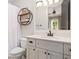Well-lit bathroom with a floating shelf, modern vanity, and ample counter space and storage at 4530 Upland Court, Cumming, GA 30040