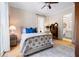 Cozy bedroom with a bed, dresser, ceiling fan, and access to an ensuite bathroom at 4530 Upland Court, Cumming, GA 30040
