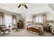 Spacious bedroom featuring seating, and multiple windows providing natural light at 4530 Upland Court, Cumming, GA 30040
