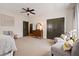 Bedroom featuring a ceiling fan, large closet, and comfortable seating at 4530 Upland Court, Cumming, GA 30040