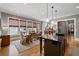Bright dining room showcases large windows, an open layout, and eat-in kitchen at 4530 Upland Court, Cumming, GA 30040