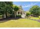 Well-maintained front yard with lush lawn and beautiful landscaping leading to a charming front porch at 4530 Upland Court, Cumming, GA 30040