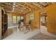 Bright home office featuring a wooden desk, shelving, and lots of natural light with easy access to a living area at 4530 Upland Court, Cumming, GA 30040