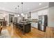 Spacious kitchen with large island, stainless steel appliances, and hardwood flooring at 4530 Upland Court, Cumming, GA 30040