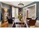 Inviting living room with hardwood floors, French doors, and stylish decor, creating a cozy ambiance at 4530 Upland Court, Cumming, GA 30040