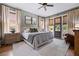 Cozy bedroom featuring neutral tones, plush bedding, and private access to the outdoors at 4530 Upland Court, Cumming, GA 30040